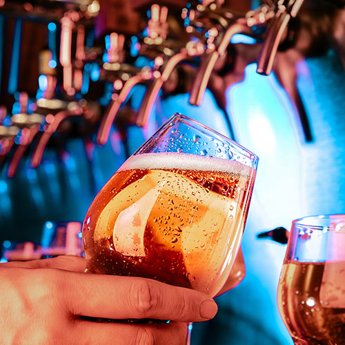 Lager being poured by barman